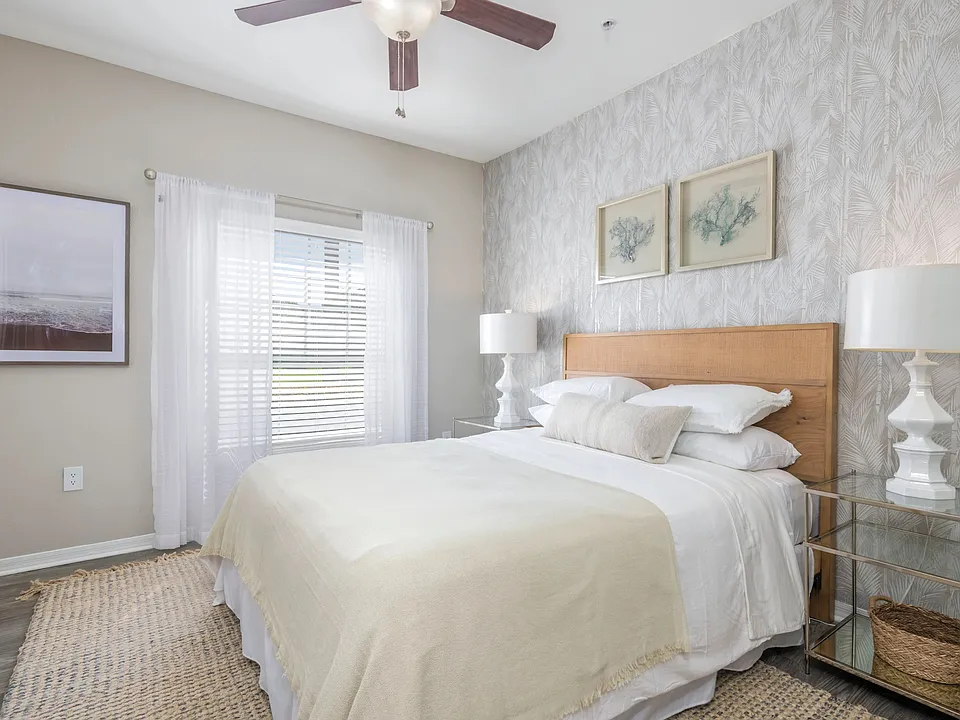 Step into the lap of luxury in our spacious master bedroom, graced with wood-style flooring and a majestic ceiling fan that's fit for royalty. Unwind in style and comfort.