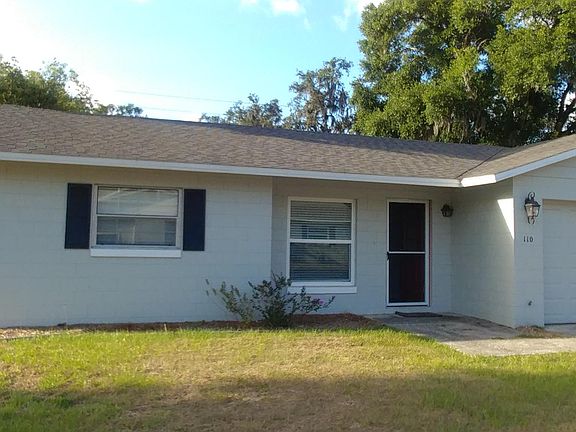One apartment in duplex building, separated by single car garage