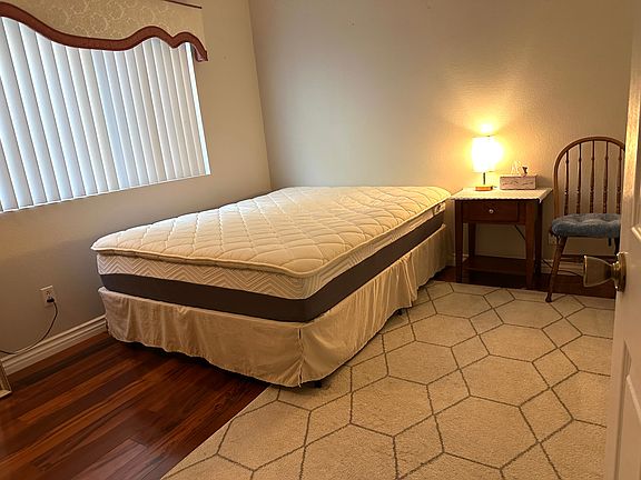 Bedroom with a queen bed and high-quality mattresses