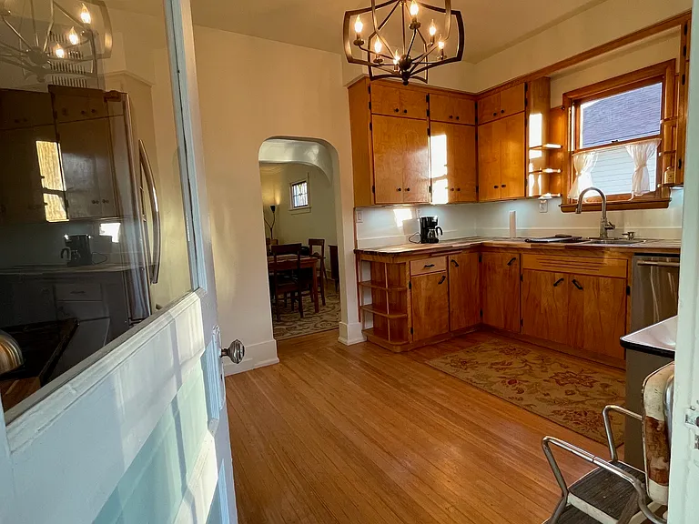 View coming in to kitchen from enclosed back porch.