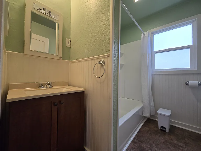 Bathroom with tub and shower.