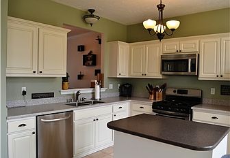 Kitchen w Corian counter and SS Appliances