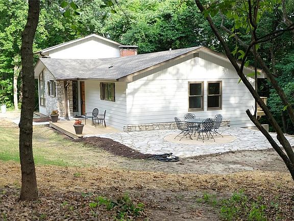 Side view of the front deck and flagstone patio entertaining area