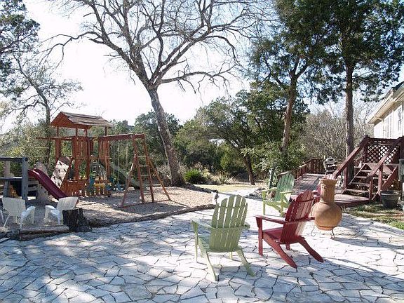 Playscape, stone patio and huge backyard for entertaining.