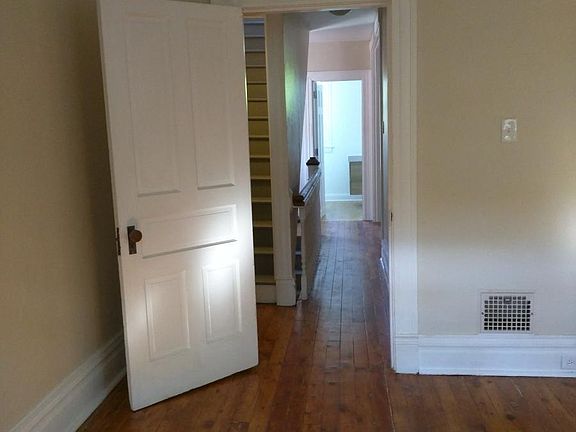 2nd floor bedroom view into and bathroom.