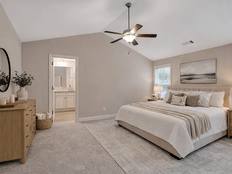 Serene primary suite with a plush king bed, refined finishes, and calming greeneryyour private retreat for rest and relaxation.