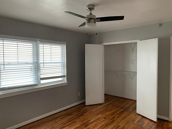 Large Bedroom with ceiling fan and extra large clothing closet. Additional closet in hall.