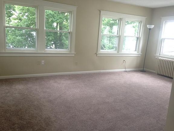 Large living room with lots of windows