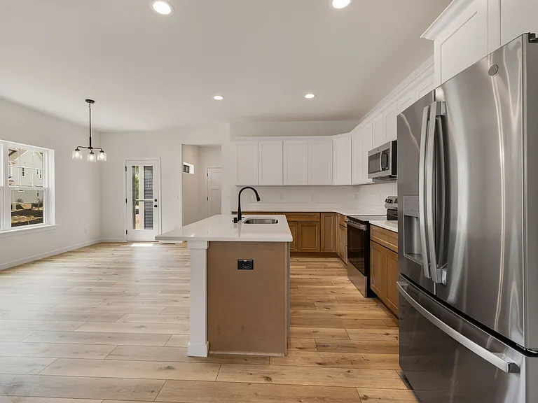 Open Concept Kitchen - Large Island, Breakfast Bar Seating, Abundant Cabinet Space & Stainless Steel Appliances!