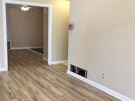 Living room looking into optional third bedroom or den.