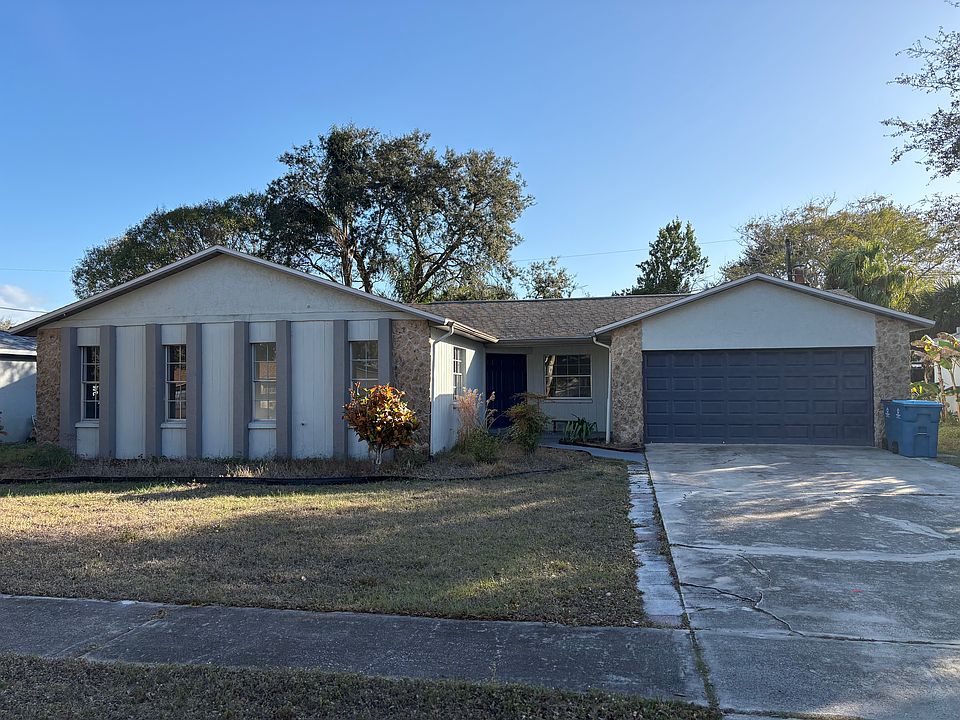 Front view of property; fenced backyard. Automatic garage door opener for security.