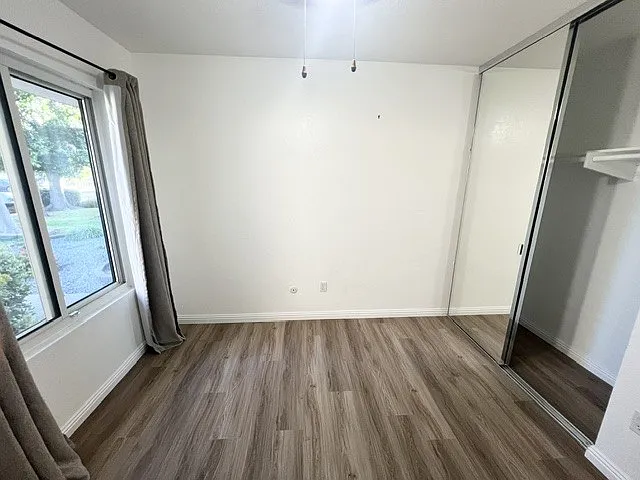 3rd bedroom (repainted and replaced brown carpet to new flooring)