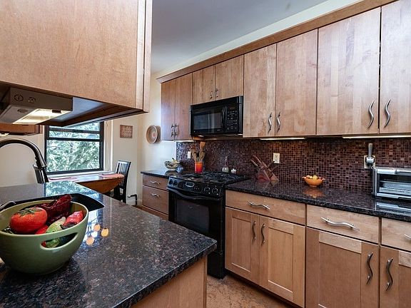 Whimsical pulls complete this cooks kitchen.