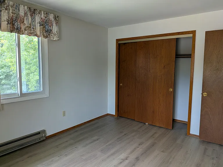 Another view of the second bedroom showing the closet