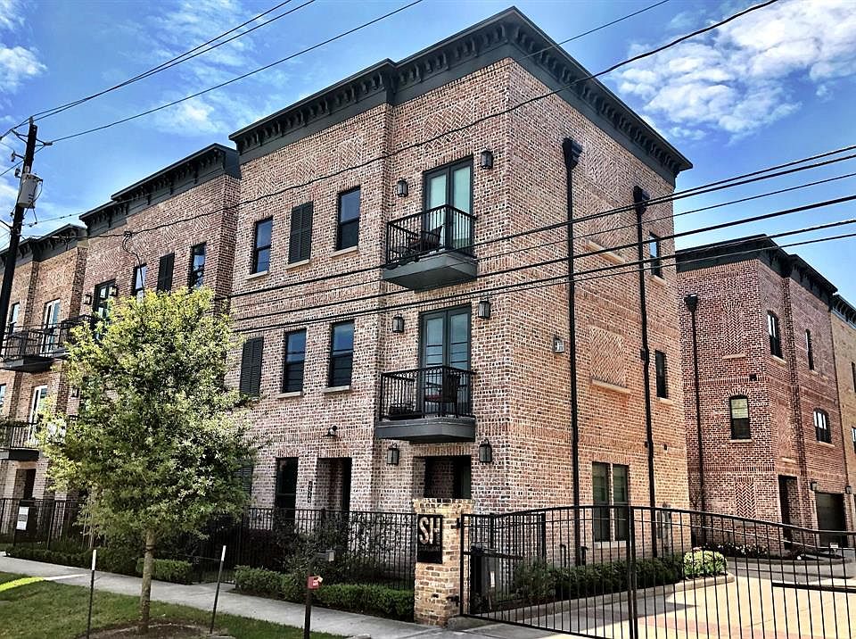 The industrial faÃ§ade of reclaimed brick gives this modern Sullivan Brotherâs home a classic feel.