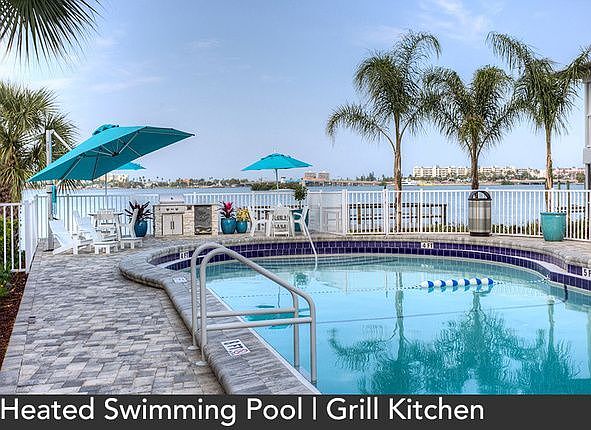 Image of the heated swimming pool with grilling area.