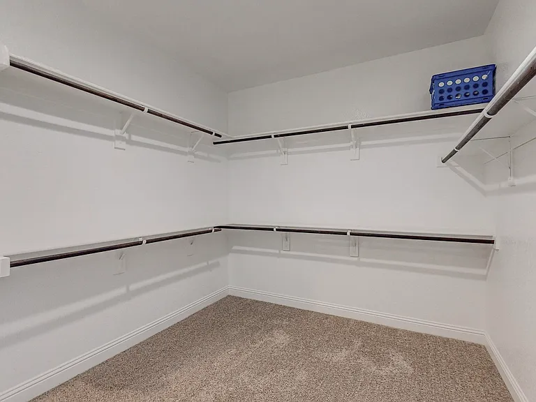 Spacious primary walk-in closet