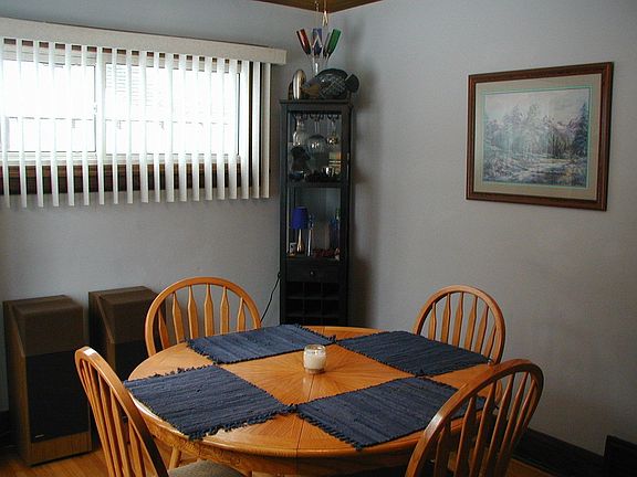 Formal dining room with piano window.