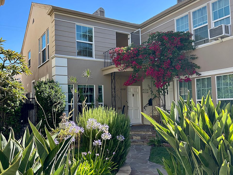 Exterior to upper unit - beautiful bougainvillea balcony
