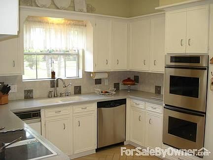 Spacious countertops, italian tile flooring, stainless steel appliances