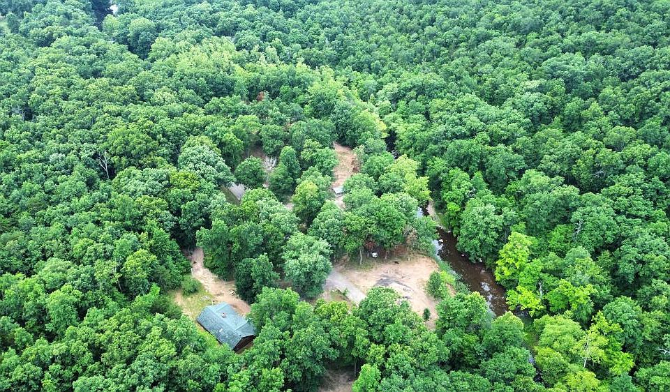 <p>Overlooking the two bedroom home, wooded acreage, and frontage along the Indian Creek</p>