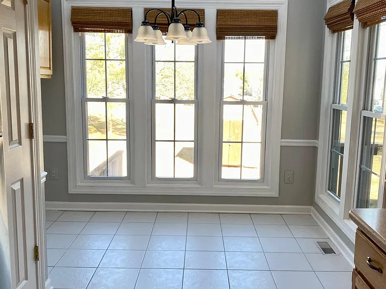 Bright eat-in kitchen with sky lights.