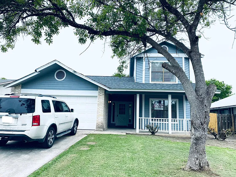 Front of the house. This porch is asking for a porch-swing and some hanging plants!