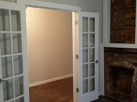 first bedroom with aesthetic fireplace