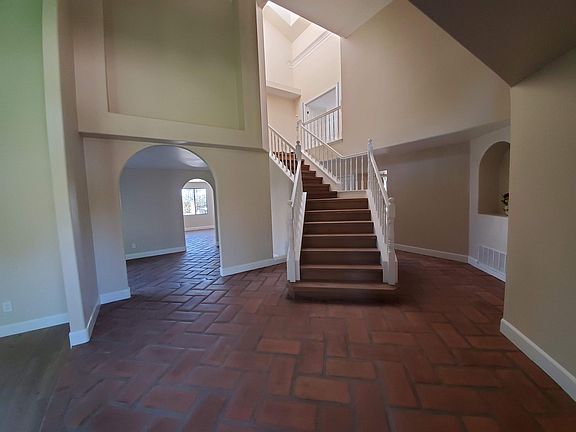 Front entry with herringbone terra cotta floors and European oak hardwood stairs and floors.
