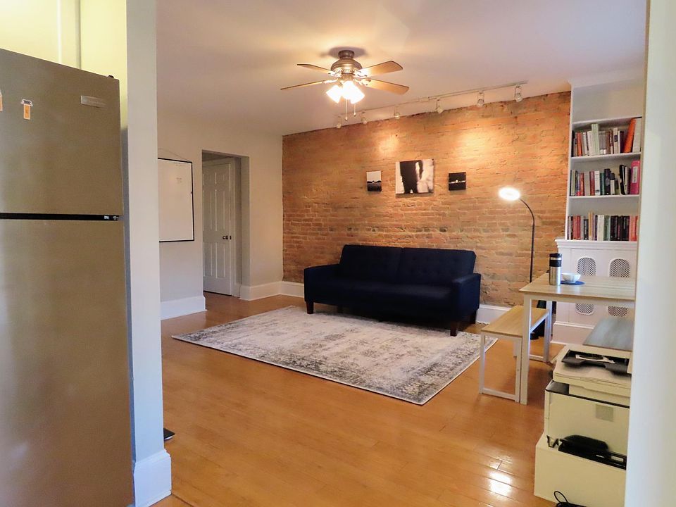Living room from the kitchen. It has a built-in bookcase, and I'll empty it when I move out. You can invite your friends and have them stay over (up to three nights without permission; possibly more with permission)! I also have a full-size air mattress i