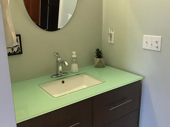 Glass bathroom counter top.