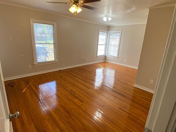 The large master bedroom with two closets and a sitting area.