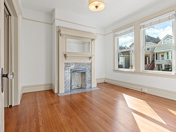 Living Room w/Decorative Fireplace.