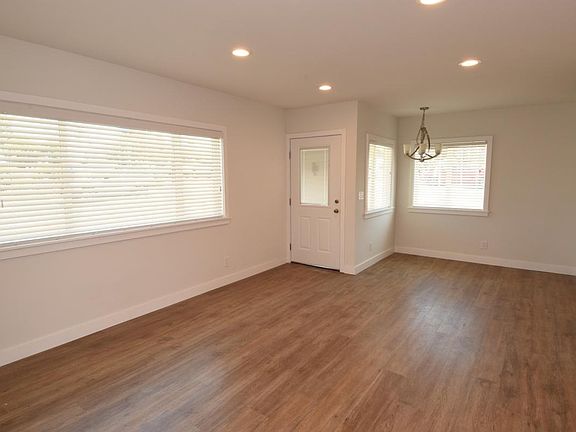 Vacant living room...lots of windows!
