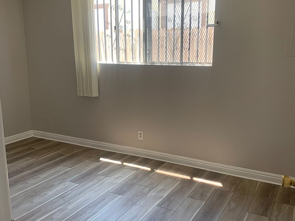 New vinyl plank flooring in bedrooms with new paint (second bedroom)