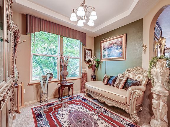 Formal Dining Room, currently sitting room, could be used fo