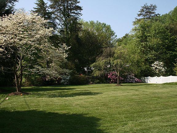Lush landscaping surrounds this home