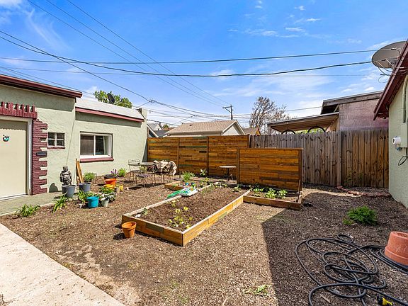 Private garden space just outside the front door with room for patio table and chairs.