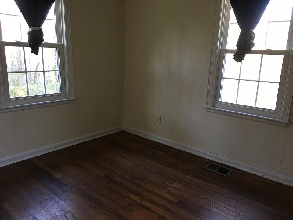 Bedroom overlooks private backyard and woods