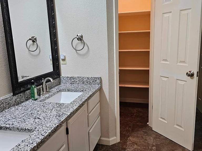 Master bath looking in to the linen closet
