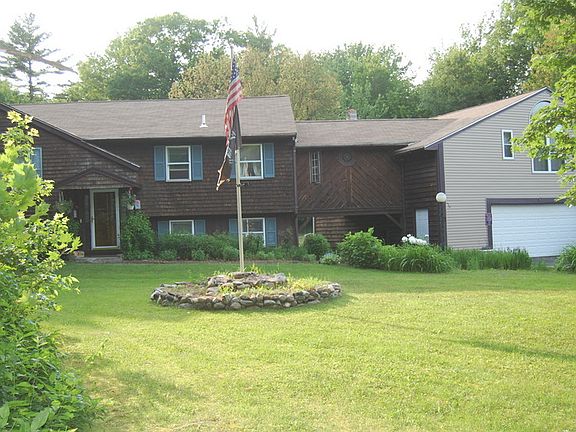 front yard : well groomed large front yard set back from the road