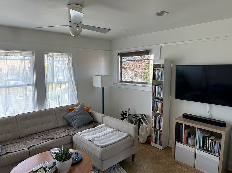 Living Room with Ceiling Fan and TV wall mount. Most Recent tenant.