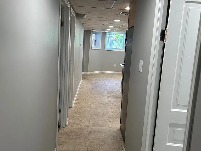 Bedrooms on the left, bathroom and kitchen on the right.
