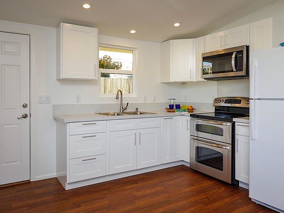 Brand new appliances in a full size gourmet kitchen that looks out onto a private garden area.