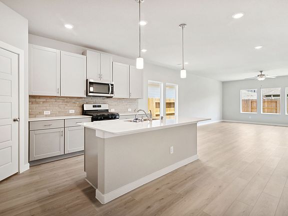 Kitchen of 2635 Colorado Creek Drive at Sundance Cove, a Meritage Homes community in Crosby, Texas.