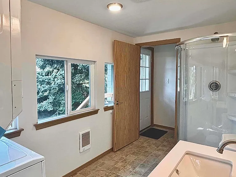2nd bathroom on first floor with washer and dryer.