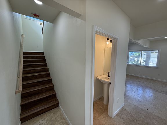 Entrance and powder room with stairs to 2nd story