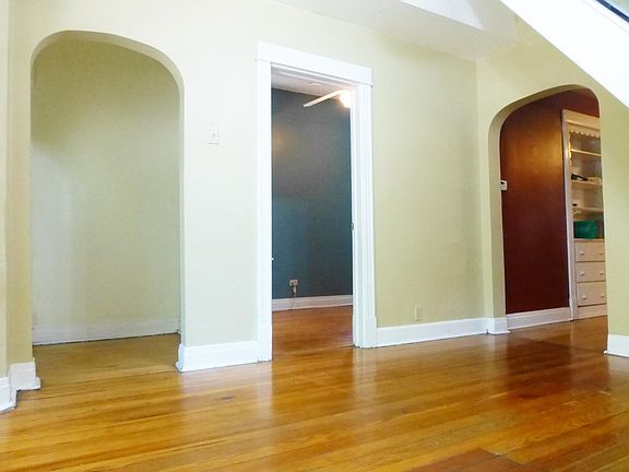 living room towards entry door, bedroom #1 and kitchen
