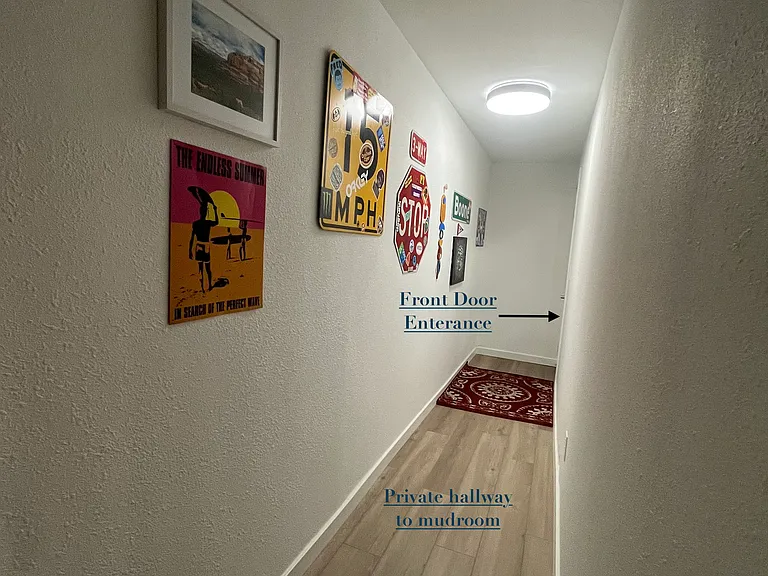 Front door leads to private hallway for unit 9.
