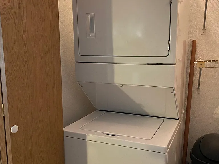 Compact washer/dryer unit included for tenant use.